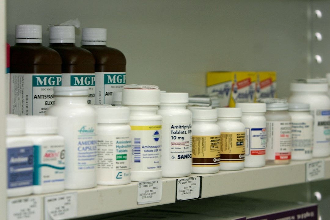 Bright pharmacy shelves filled with medicine packages, illustrating Iran’s growing medication shortages