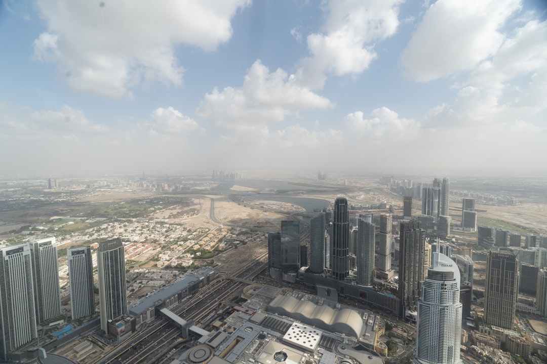 Bright Middle Eastern city skyline illustrating the regional and economic risks of escalating conflict