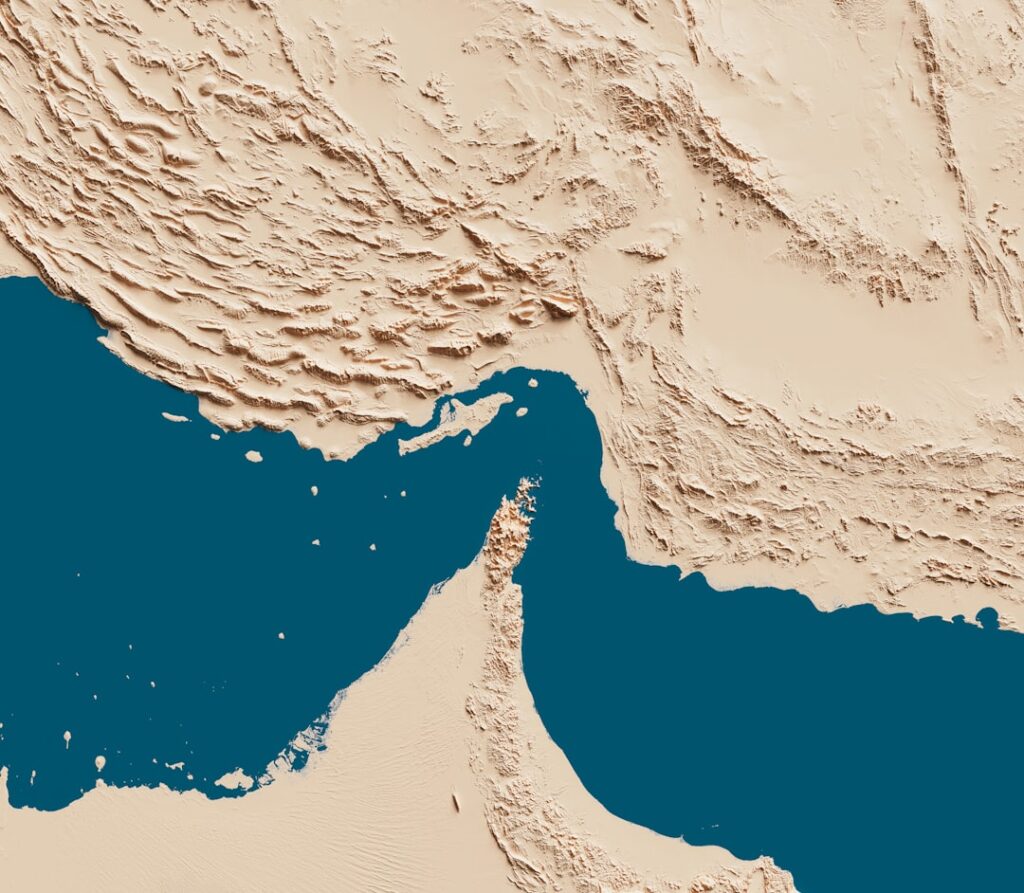 Aerial map view of the Strait of Hormuz between Iran and Oman, illustrating a critical global shipping and energy route