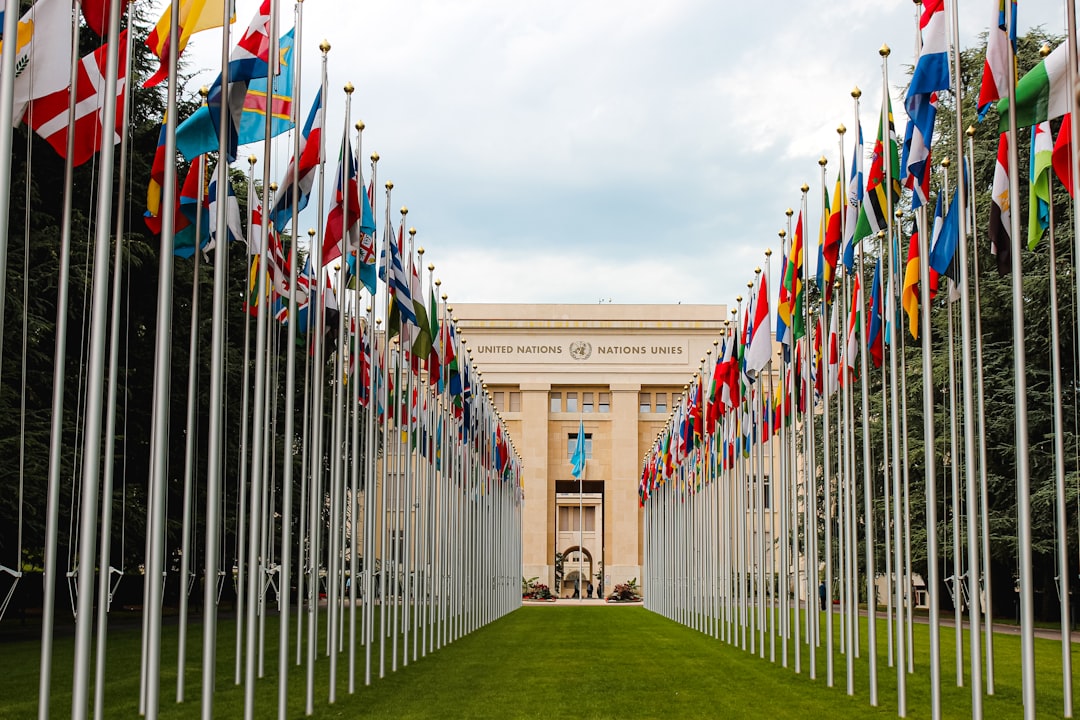 Flags outside the United Nations in Geneva, illustrating international scrutiny and accountability
