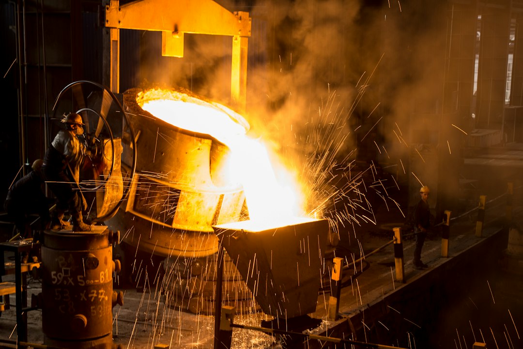 Representative photograph of glowing molten metal being poured inside a steel plant; not an image of the Kryvyi Rih facility or a wartime strike.
